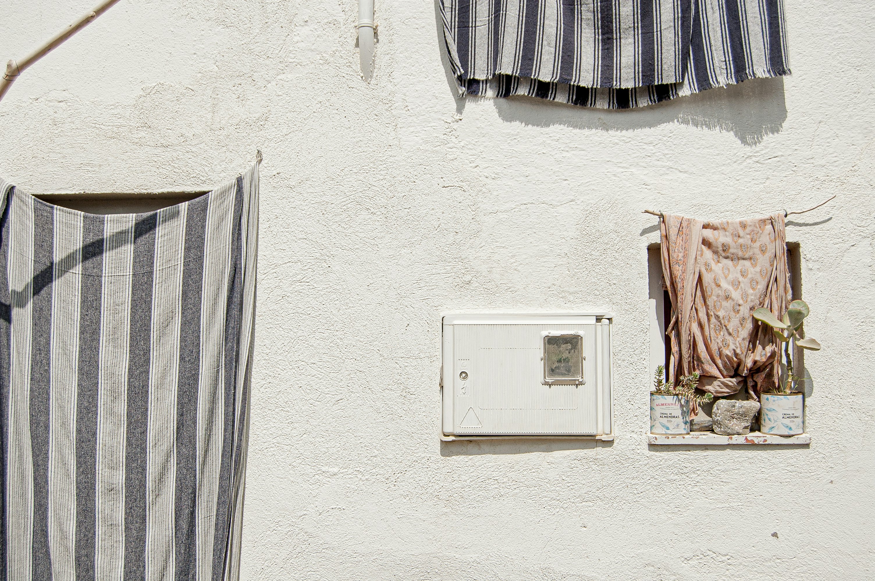 white thermostat mounted on white wall